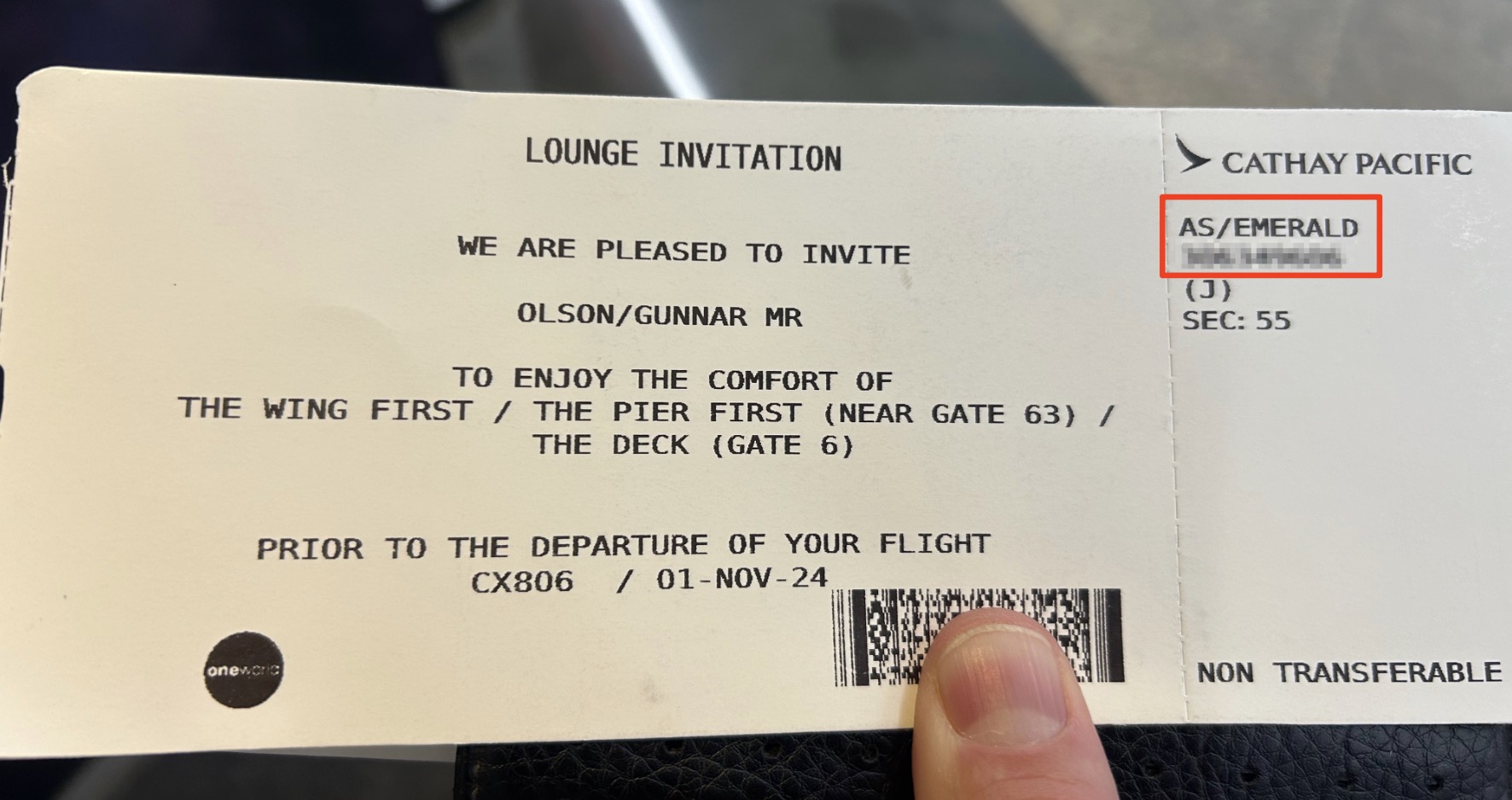 A Lounge invitation from Cathay Pacific printed on a boarding pass card showing a passenger has access to First Class Lounges in Hong Kong